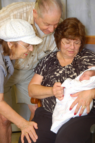 The grandparents enjoy a moment with their new grandson.